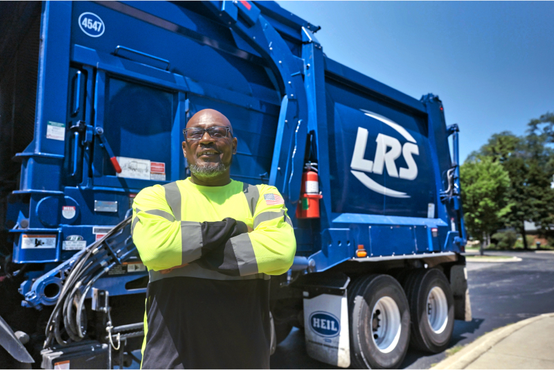 LRS Employee in front of LRS truck